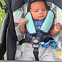 Adonis joined the competition — help win amazing prizes! baby, stroller, child, infant, seatbelt, pacifier, sunglasses, keys, clothing, blue, gray, outdoor, grass, person, hand, toy, baby_gear, fabric, cute, portrait