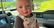 Duston joined the competition — help win amazing prizes! baby, child, infant, car_interior, overalls, blue_eyes, hand, seat, window, suburban, daylight, person, cute, clothing, portrait, smiling, skin, short_hair, vehicle, seatbelt
