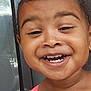 Ka Miyah-Kynd is registered to the contest to win money with this photo: cheerful, child, closeup, curly_hair, cute, expression, face, happy, head, joyful, outdoor, person, pink_strap, portrait, reflection, skin, smile, teeth, window, young