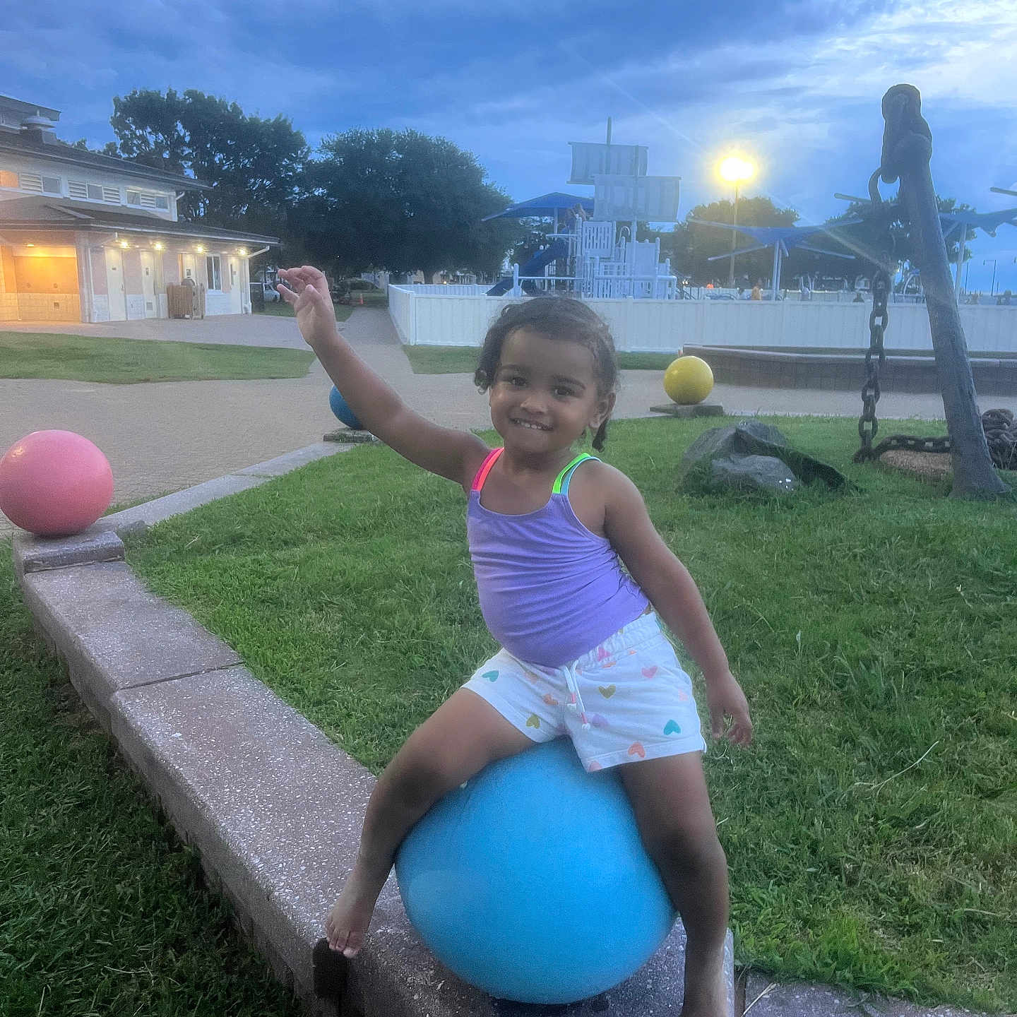 Ka Miyah-Kynd joined the competition — help win amazing prizes! anchor, ball, barefoot, child, colorful_clothing, evening, fun, grass, happy, outdoor, park, person, play, playground, recreation, sculpture, shorts, smiling, tank_top, twilight