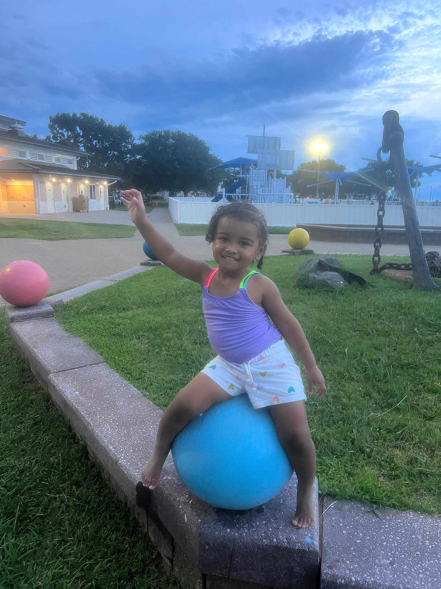 Ka Miyah-Kynd joined the competition — help win amazing prizes! anchor, ball, barefoot, child, colorful_clothing, evening, fun, grass, happy, outdoor, park, person, play, playground, recreation, sculpture, shorts, smiling, tank_top, twilight