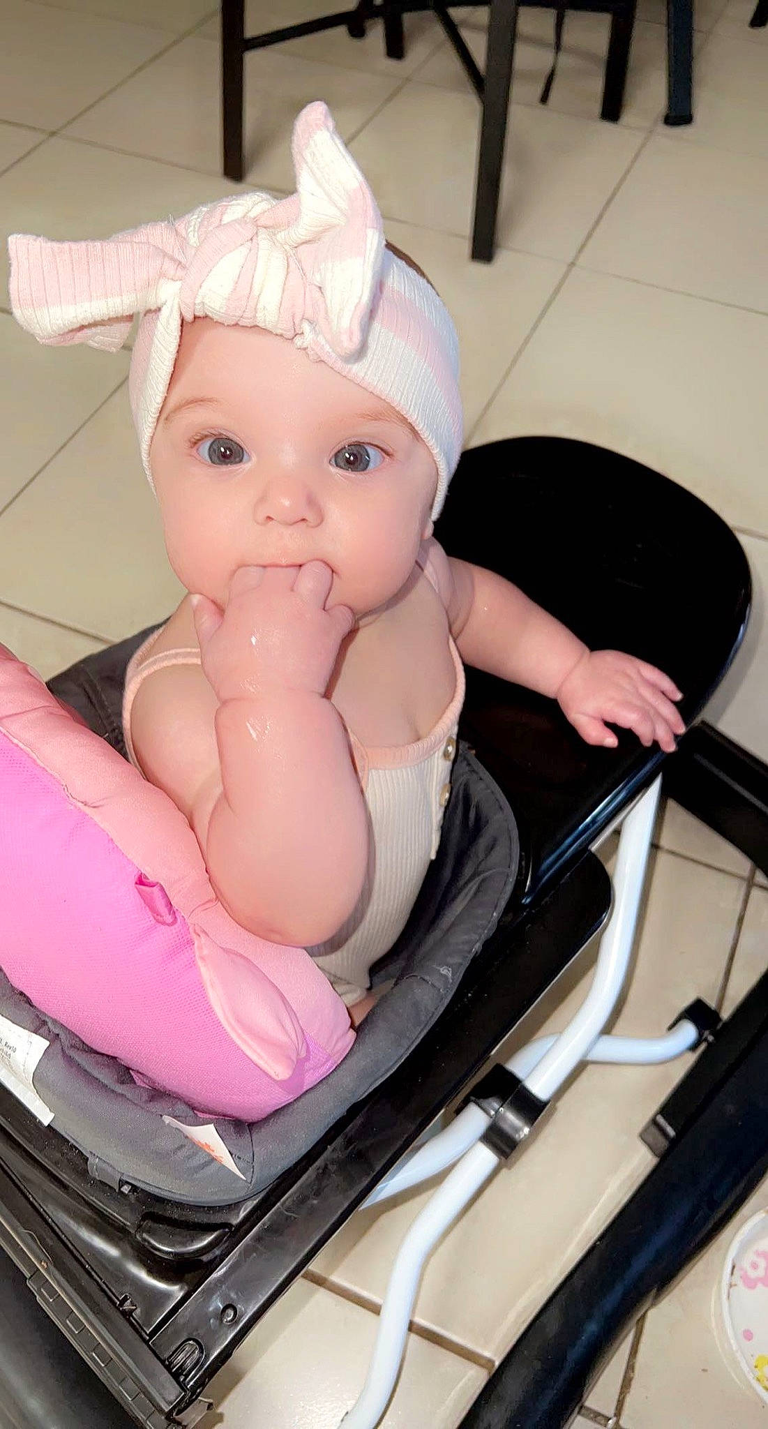 Emberlynn is registered to the contest to win money with this photo: arm, baby, baby_products, baby_toddler_clothing, cheek, child, comfort, eyelash, fashion_accessory, finger, hand, happy, hat, headwear, leg, person, pink, product, sitting, thumb