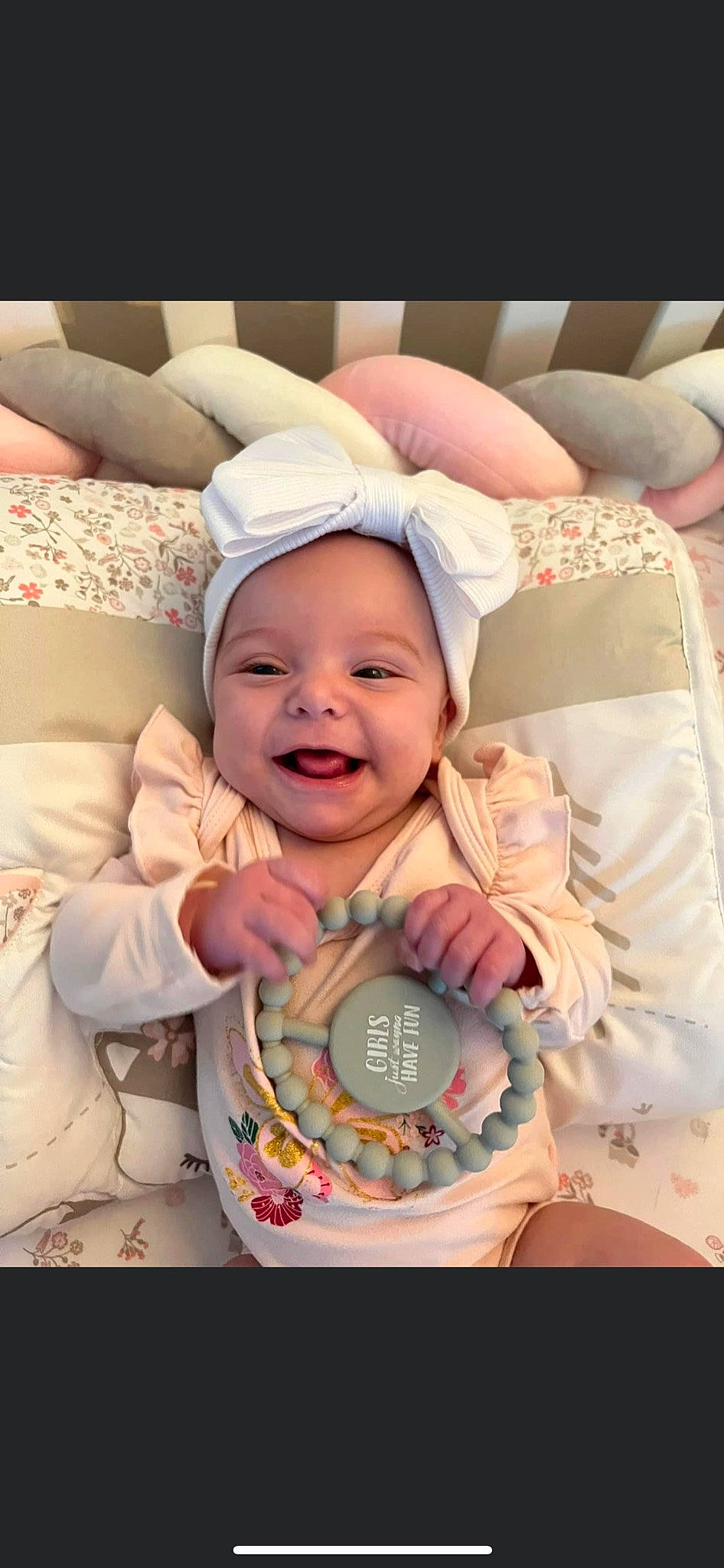 Emberlynn is registered to the contest to win money with this photo: baby, baby_products, baby_safety, baby_sleeping, baby_toddler_clothing, bedtime, cap, cheek, child, comfort, fashion_accessory, gesture, happy, headgear, joy, linens, pattern, person, pink, smile