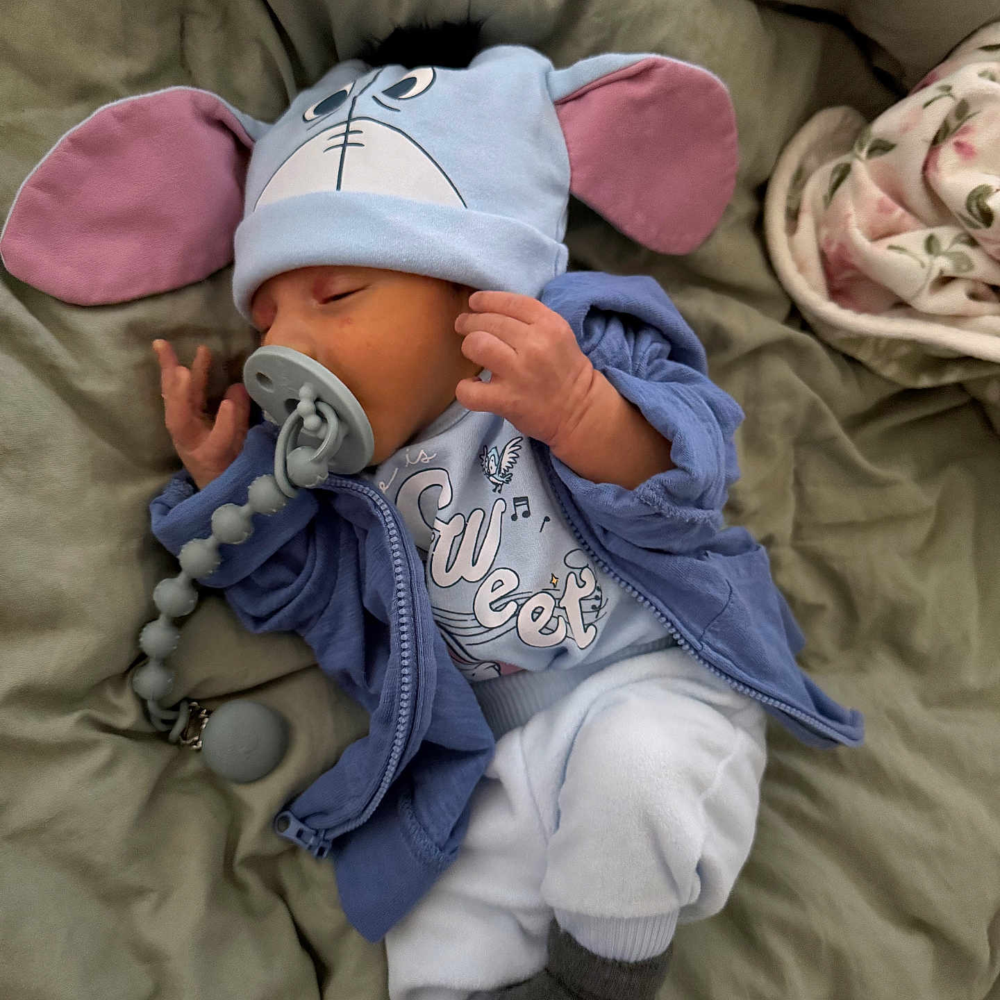 Ravi joined the competition — help win amazing prizes! baby, bed, blanket, blue_clothing, child, clothing, comfort, cozy, cute, hat, home, infant, lying_down, nap, pacifier, rest, sleeping, smock, sock, soft