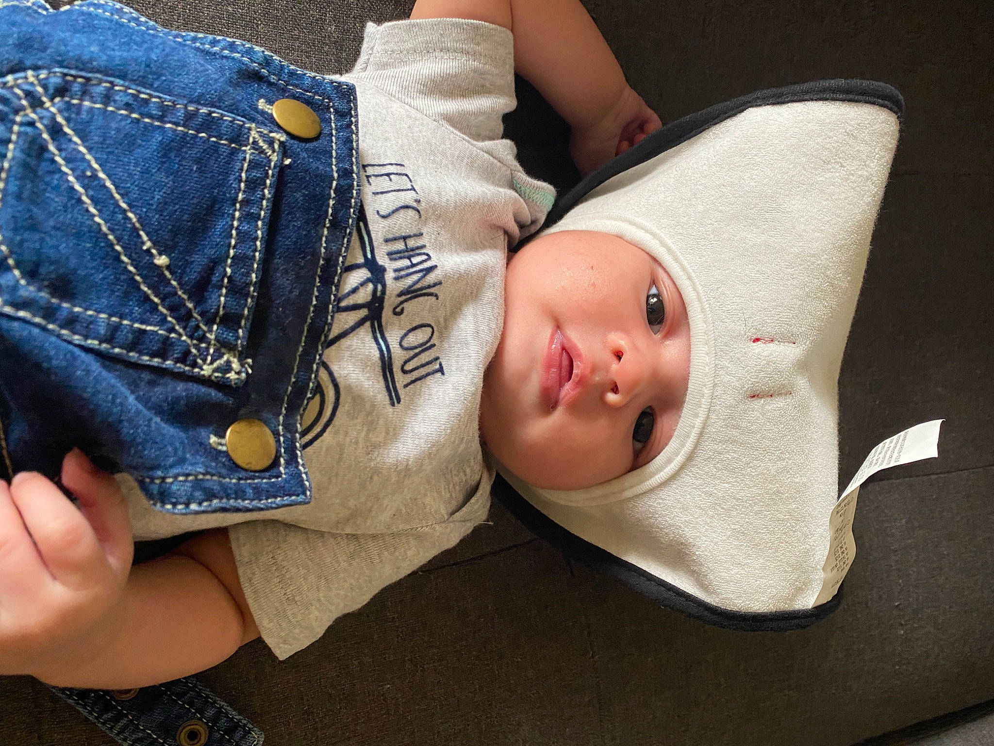 Mathias is registered to the contest to win money with this photo: baby, child, denim, foot, footwear, hand, headwear, jeans, joint, leg, person, shoe, skin, toddler