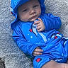 baby, blue_outfit, hat, shark_pattern, blanket, outdoor, grass, gravel, child, infant, clothing, cute, relaxed, portrait, person, skin, smiling, headwear, texture, nature