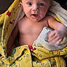 Kaiden Kopas joined the competition — help win amazing prizes! baby, child, towel, yellow, patterned_towel, curious, wide_eyes, expression, indoor, portrait, skin, infant, sitting, hand, cute, young, person, wrap, colorful, blanket