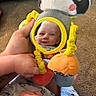 baby, reflection, mirror, toy, panda, hand, carpet, smile, child, cute, play, infant, soft_toy, yellow, orange, blue, clothing, person, closeup, happy