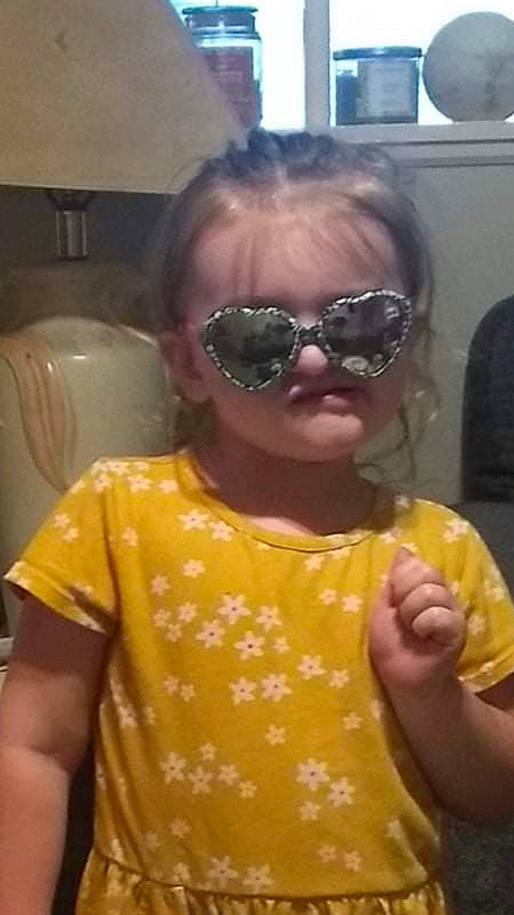 Indie joined the competition — help win amazing prizes! child, eye_glass_accessory, eyewear, finger, fun, gesture, glass, glasses, goggles, head, lip, mouth, neck, person, personal_protective_equipment, sleeve, sunglasses, t_shirt, thumb, toddler