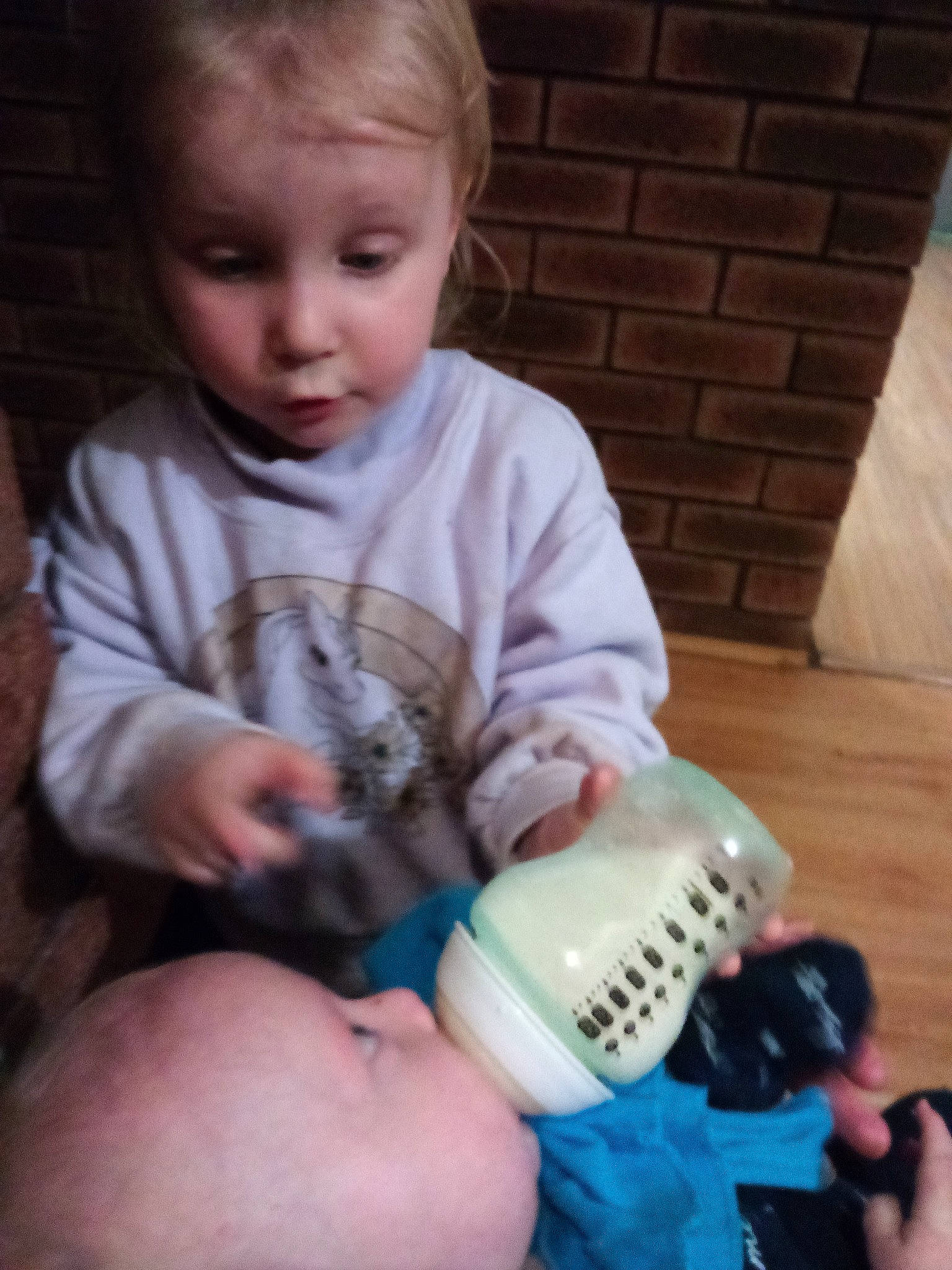 Ava is registered to the contest to win money with this photo: baby, bottle, child, drink, drinkware, person, play, product, tableware, toddler