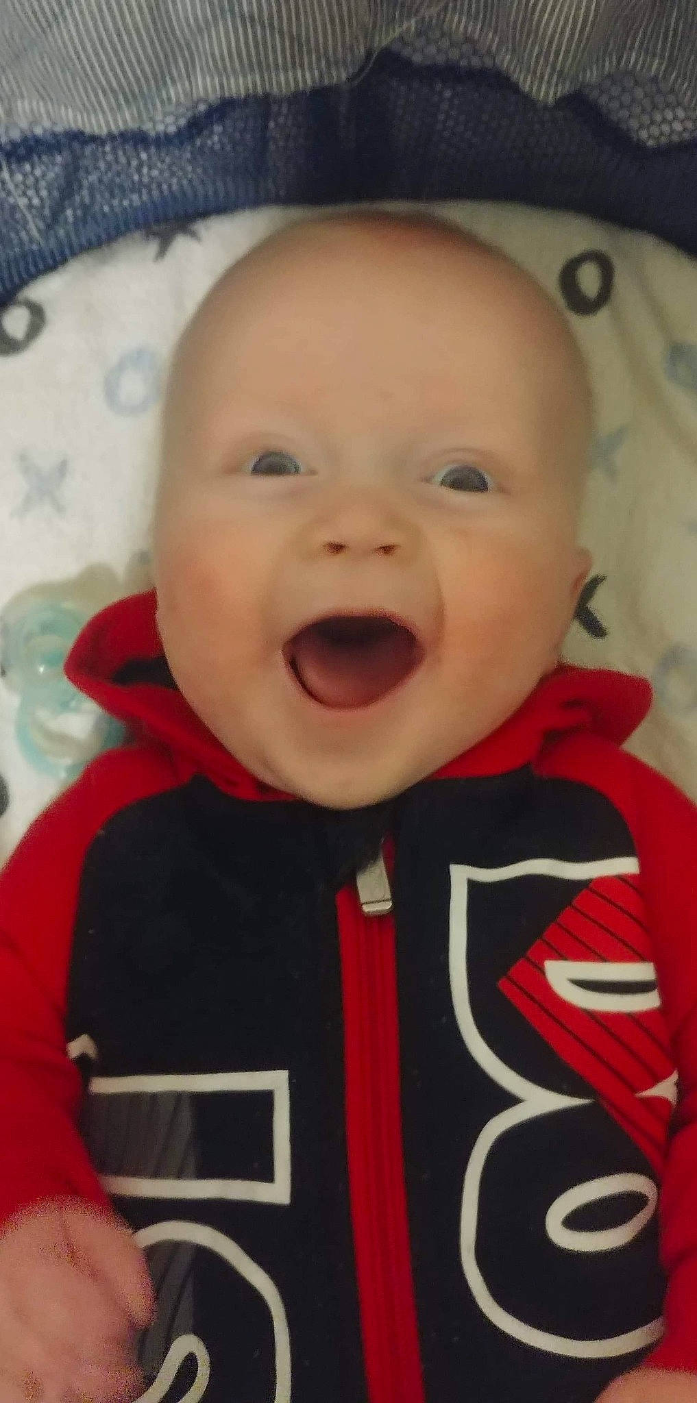 Bronx is registered to the contest to win money with this photo: baby, baby_making_funny_faces, cheek, child, chin, eye, eyebrow, face, facial_expression, forehead, head, laugh, lip, mouth, nose, organ, person, product, skin, smile