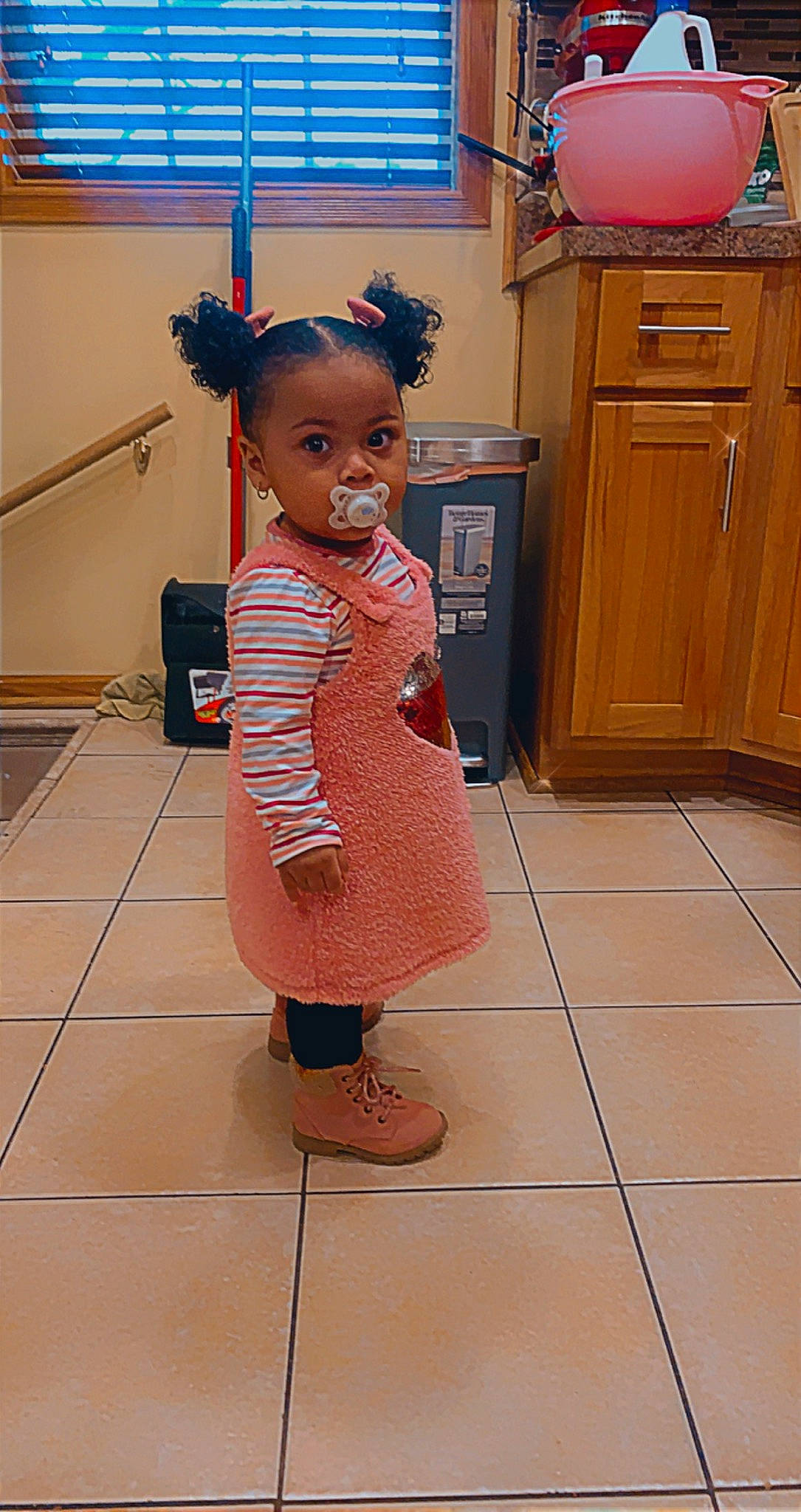 Kianna joined the competition — help win amazing prizes! cabinetry, chest_of_drawers, cupboard, drawer, dresser, fashion_design, floor, flooring, hardwood, home_appliance, human_leg, kitchen, kitchen_appliance, major_appliance, person, refrigerator, sandal, standing, toddler, toy