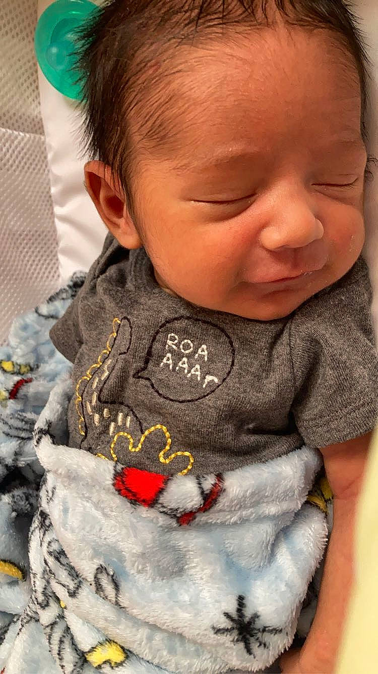 Elvie joined the competition — help win amazing prizes! baby, baby_toddler_clothing, cheek, chin, ear, eyelash, green, happy, iris, lip, mammal, mouth, neck, nose, outerwear, people, person, skin, sleeve, t_shirt