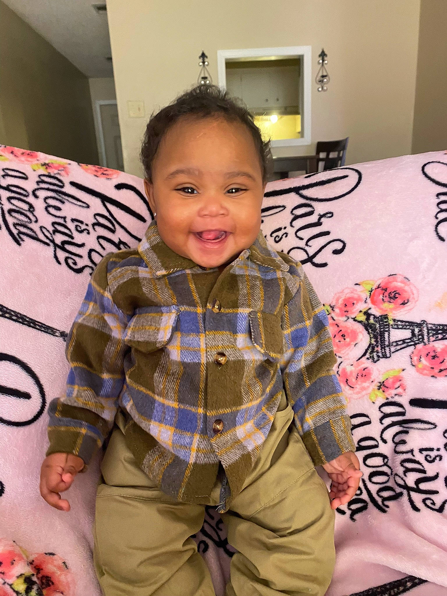 Karya is registered to the contest to win money with this photo: beauty, belt, child, cool, facial_expression, flooring, fun, hairstyle, happy, joint, joy, khaki_pants, organ, pattern, person, plaid, room, sleeve, smile, t_shirt