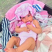 Talayah joined the competition — help win amazing prizes! baby, infant, child, swimsuit, bonnet, blanket, towel, playmat, indoors, cute, skin, foot, hand, face, smile, striped, pink, relaxing, lying, soft