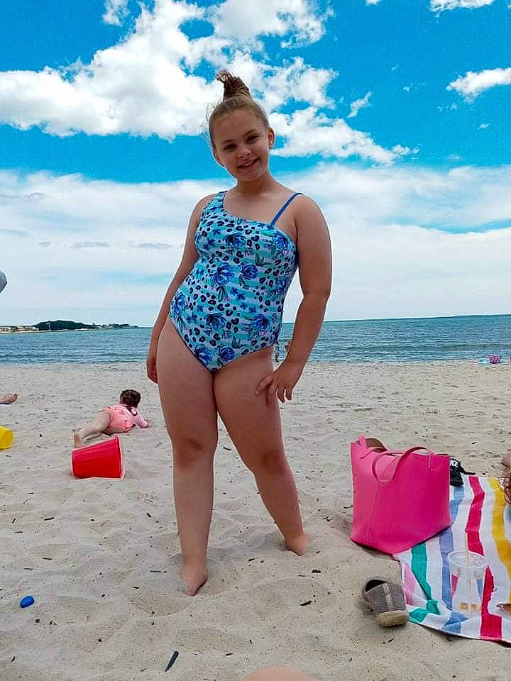 Audrianna is registered to the contest to win money with this photo: aqua, beach, blue, brassiere, cloud, fun, happy, joy, leg, leisure, one_piece_swimsuit, people_in_nature, people_on_beach, person, sand, sky, smile, swimwear, thigh, travel