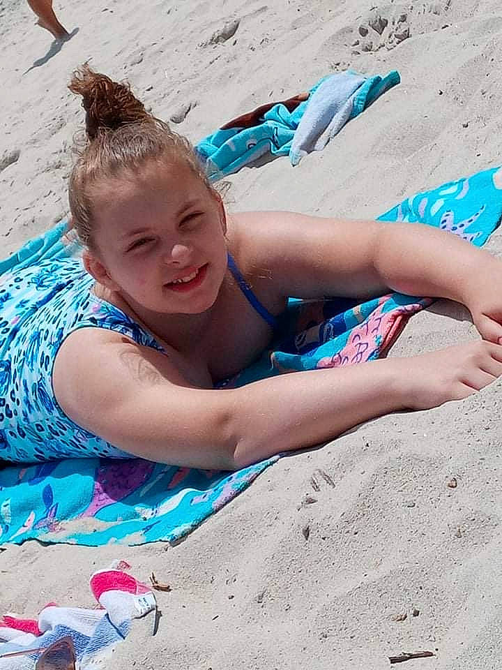 Audrianna is registered to the contest to win money with this photo: aqua, baby, barefoot, beach, blue, child, electric_blue, fun, happy, human_leg, joy, leisure, people_in_nature, people_on_beach, person, recreation, sand, sitting, smile, swimwear