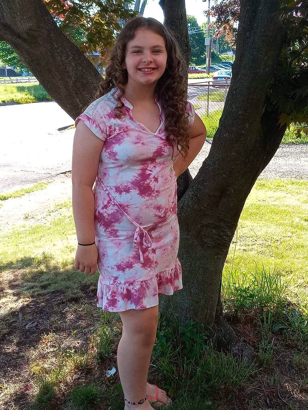 Audrianna is registered to the contest to win money with this photo: day_dress, fawn, formal_wear, grass, joy, knee, leg, long_hair, magenta, pattern, people_in_nature, person, plant, shoe, shoulder, sleeve, smile, street_fashion, thigh, tree