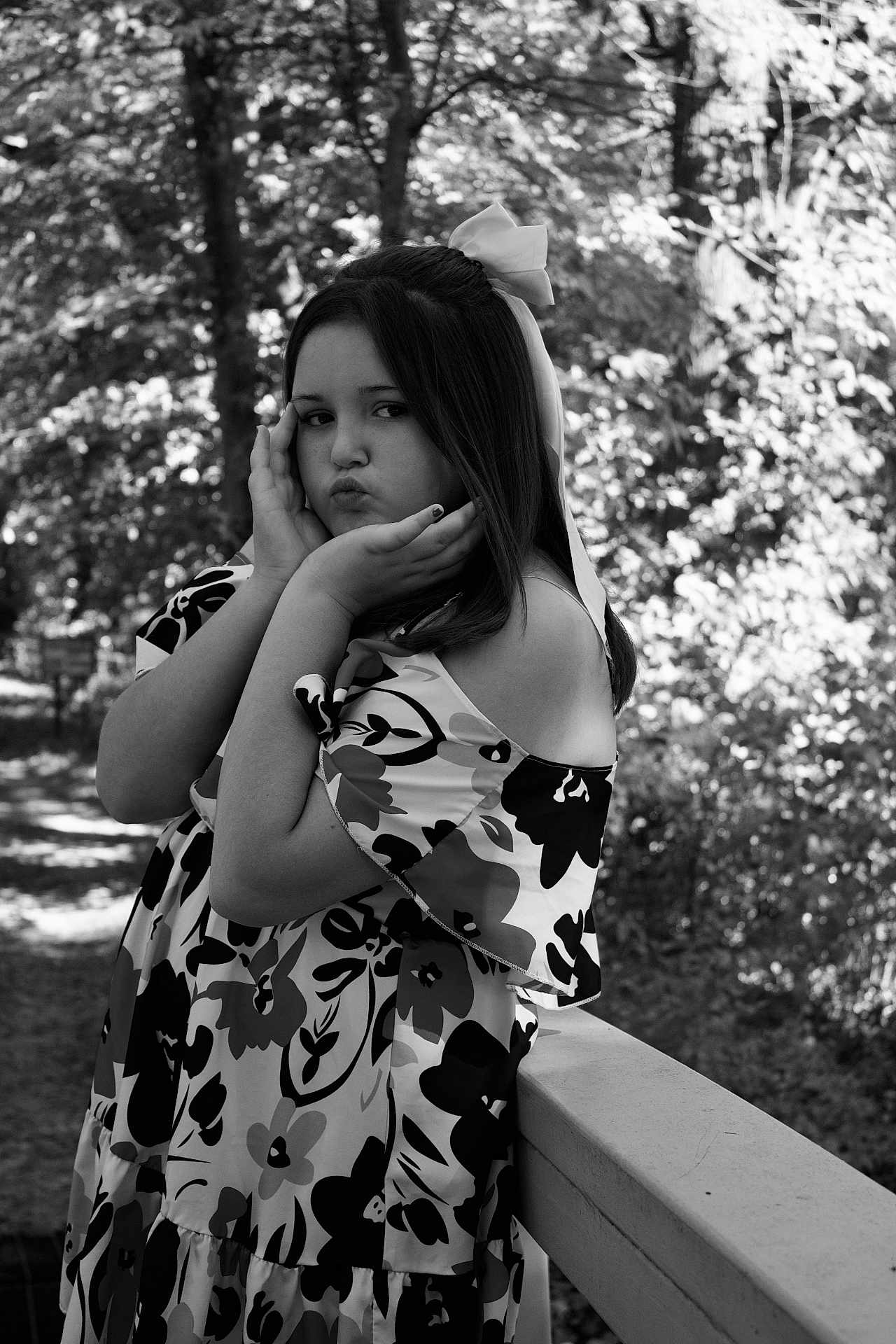 Addilynn joined the competition — help win amazing prizes! child, girl, black_and_white, portrait, outdoor, trees, nature, flower_pattern, dress, bow, pouting, posing, railing, young, person, smile, leisure, fashion, casual, daylight