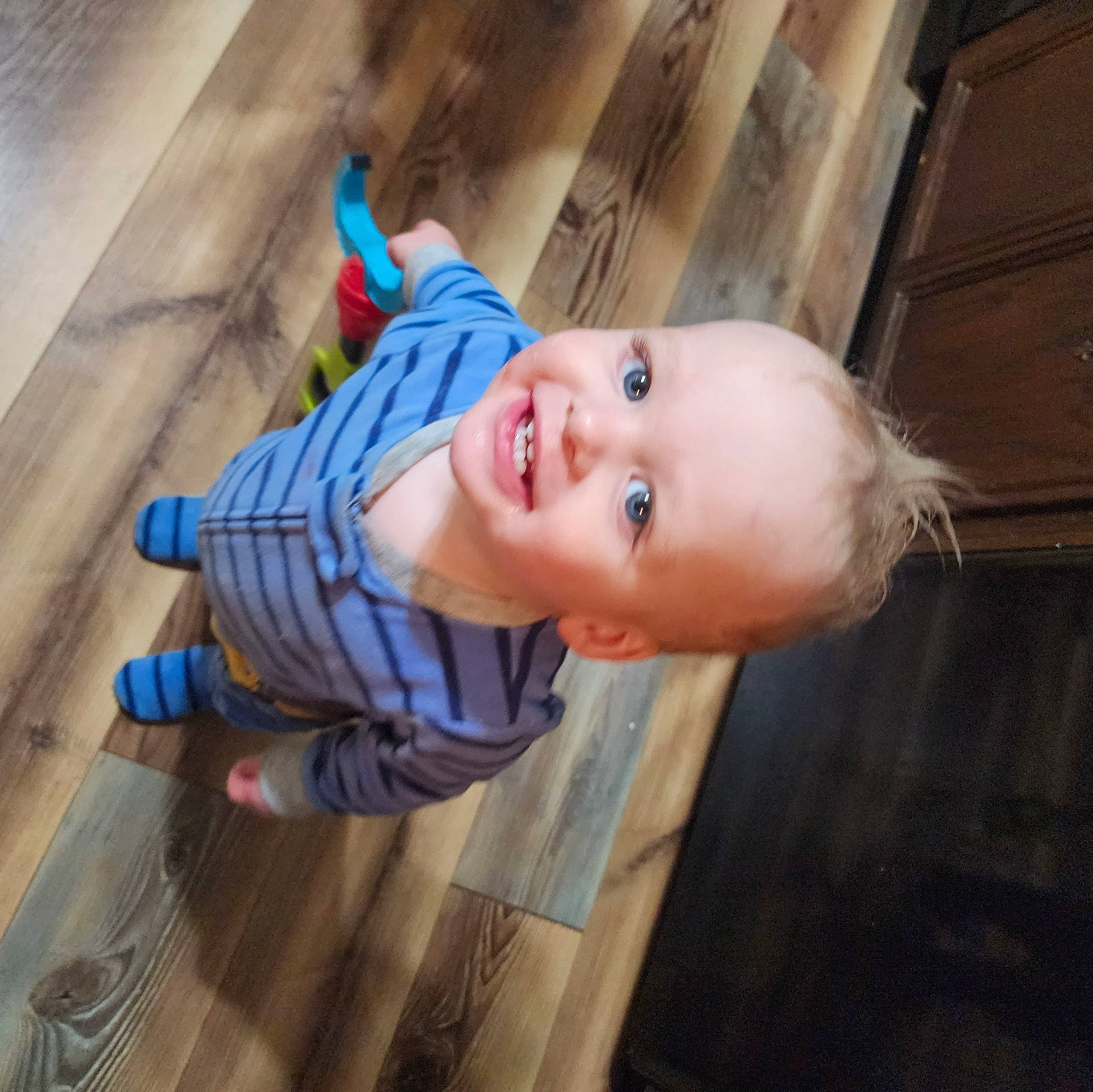Caleb joined the competition — help win amazing prizes! baby, baby_toddler_clothing, cheek, child, electric_blue, floor, flooring, fun, happy, hardwood, iris, joy, nose, pattern, person, sitting, smile, toddler, varnish, wood