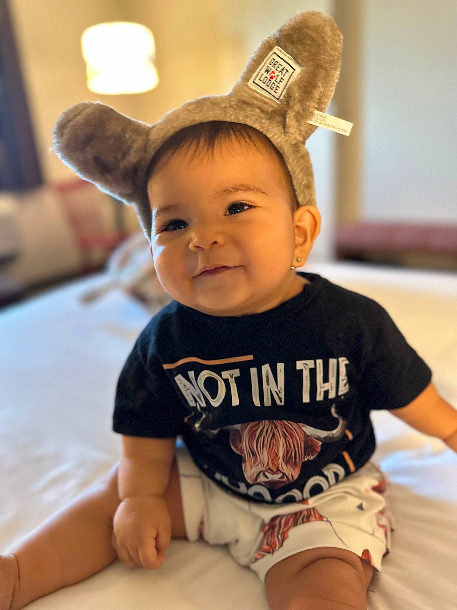 Kehlani is registered to the contest to win money with this photo: arm, baby, baby_toddler_clothing, cheek, child, chin, comfort, eye, flooring, fun, happy, human_leg, person, shorts, skin, sleeve, smile, t_shirt, thigh, toddler
