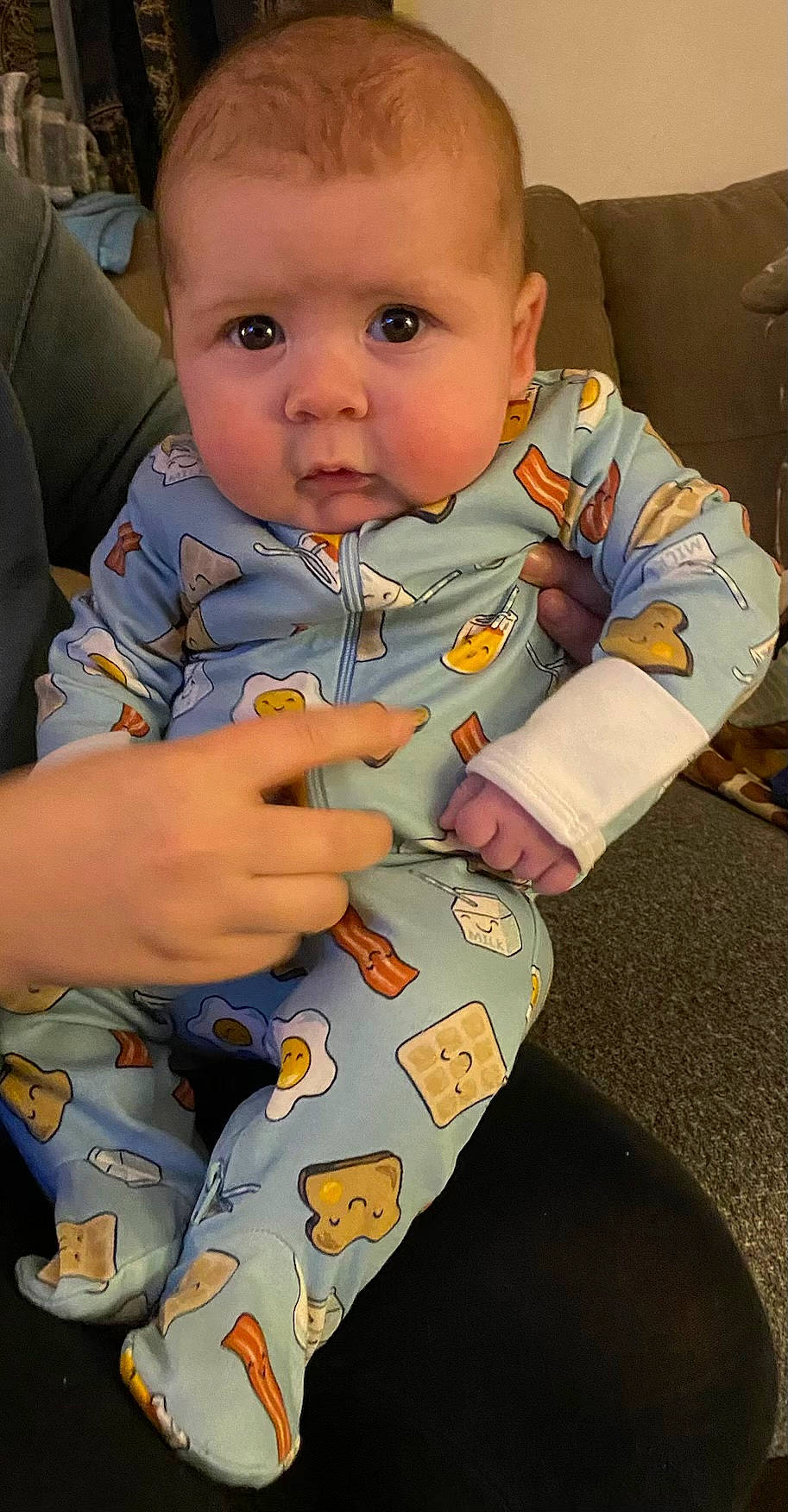 Jayden is registered to the contest to win money with this photo: baby, baby_products, baby_toddler_clothing, cheek, child, comfort, eye, face, finger, gesture, hand, lap, mouth, nail, nose, person, sitting, skin, sleeve, thumb