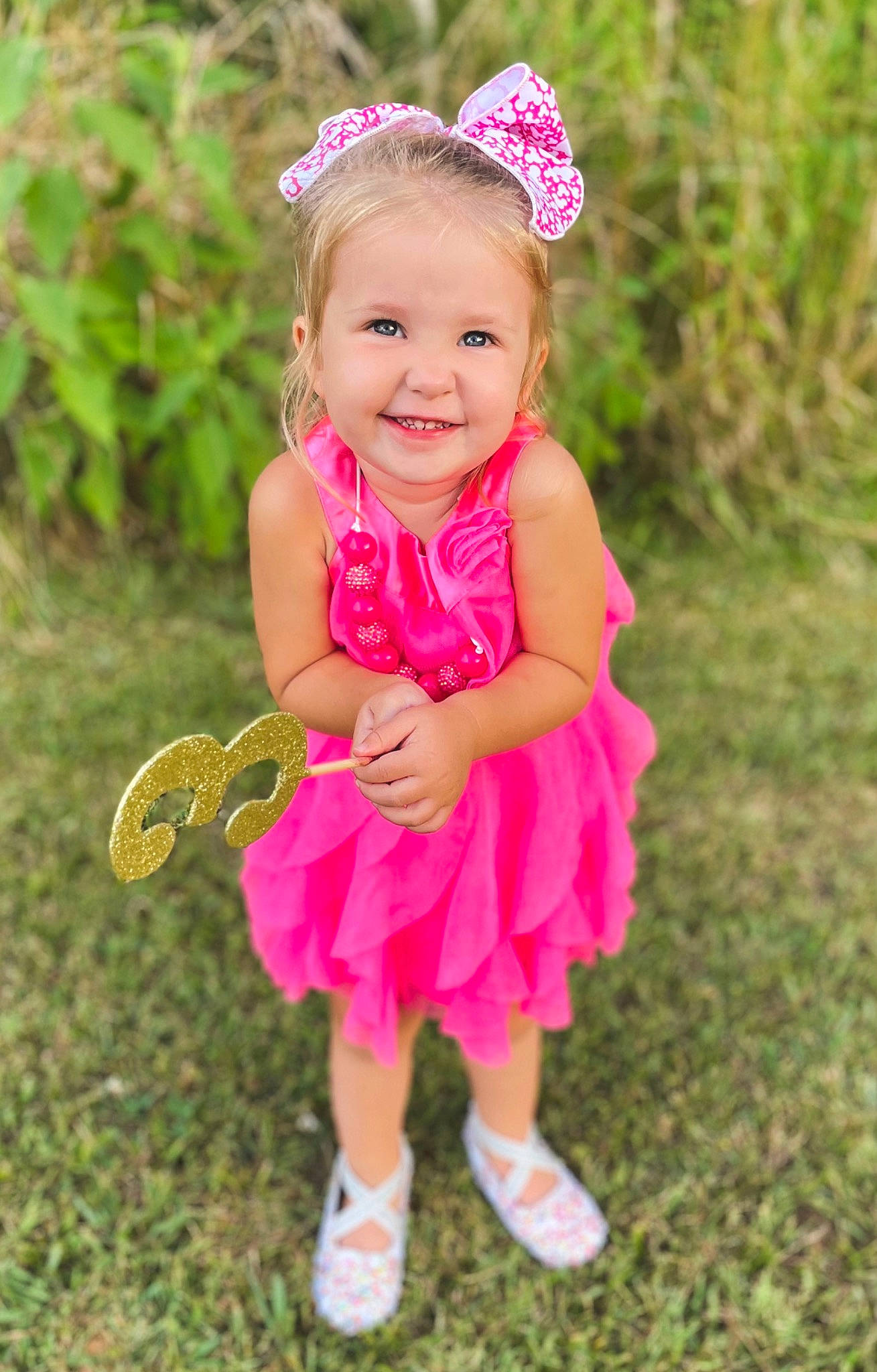 Meredith joined the competition — help win amazing prizes! baby, baby_toddler_clothing, child, event, fun, grass, hair_accessory, happy, headband, headpiece, jewellery, joy, magenta, necklace, people_in_nature, person, pink, plant, skin, smile