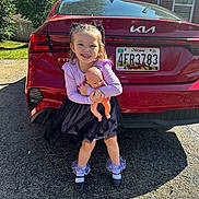 Amelia joined the competition — help win amazing prizes! alloywheel, car, carwheel, child, clothing, face, female, footwear, girl, head, licenseplate, machine, person, photography, portrait, shoe, spoke, tire, transportation, vehicle