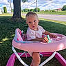 Catherine is registered to the contest to win money with this photo: baby, child, infant, walker, pink_walker, outdoor, lawn, grass, tree, road, sunlight, summer, blue_sky, clouds, portrait, sitting, curious, toy, baby_clothing, residential_area