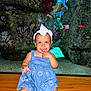 aquarium, baby, blue_dress, child, coral, cute, finger_in_mouth, girl, glass, headband, indoor, person, portrait, rocks, sitting, smiling, toddler, underwater, water, wooden_bench