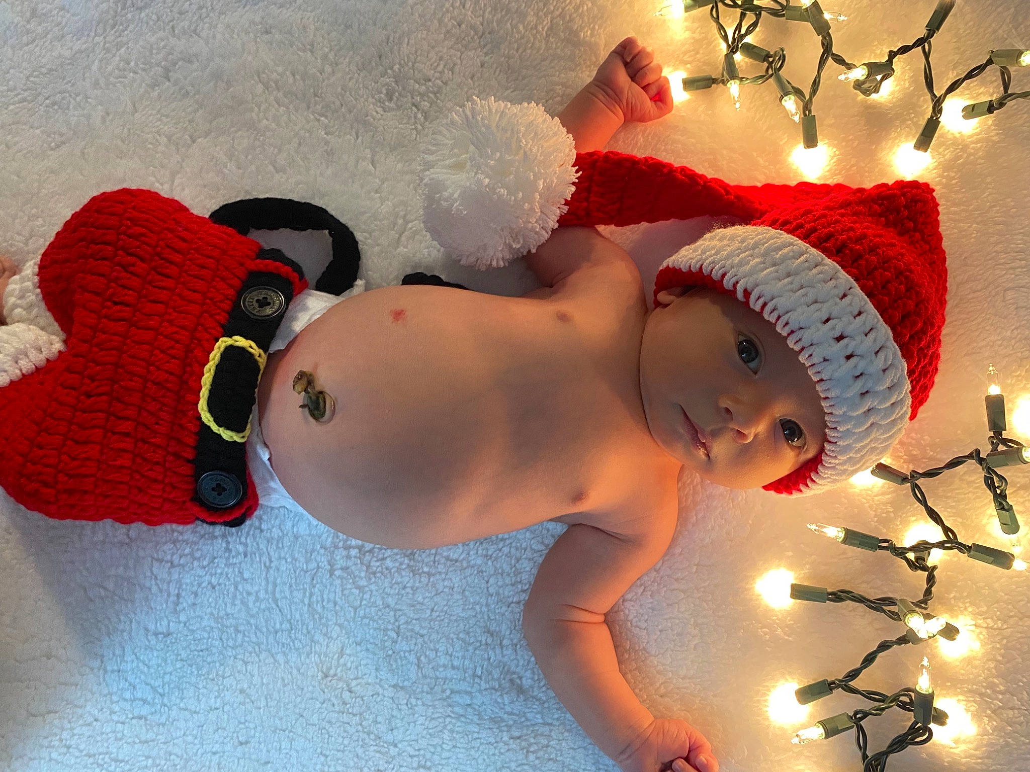Adrian is registered to the contest to win money with this photo: abdomen, baby, baby_toddler_clothing, chest, costume_hat, event, fun, happy, hat, head, headgear, headwear, human_body, light, navel, ornament, person, smile, thigh, toddler