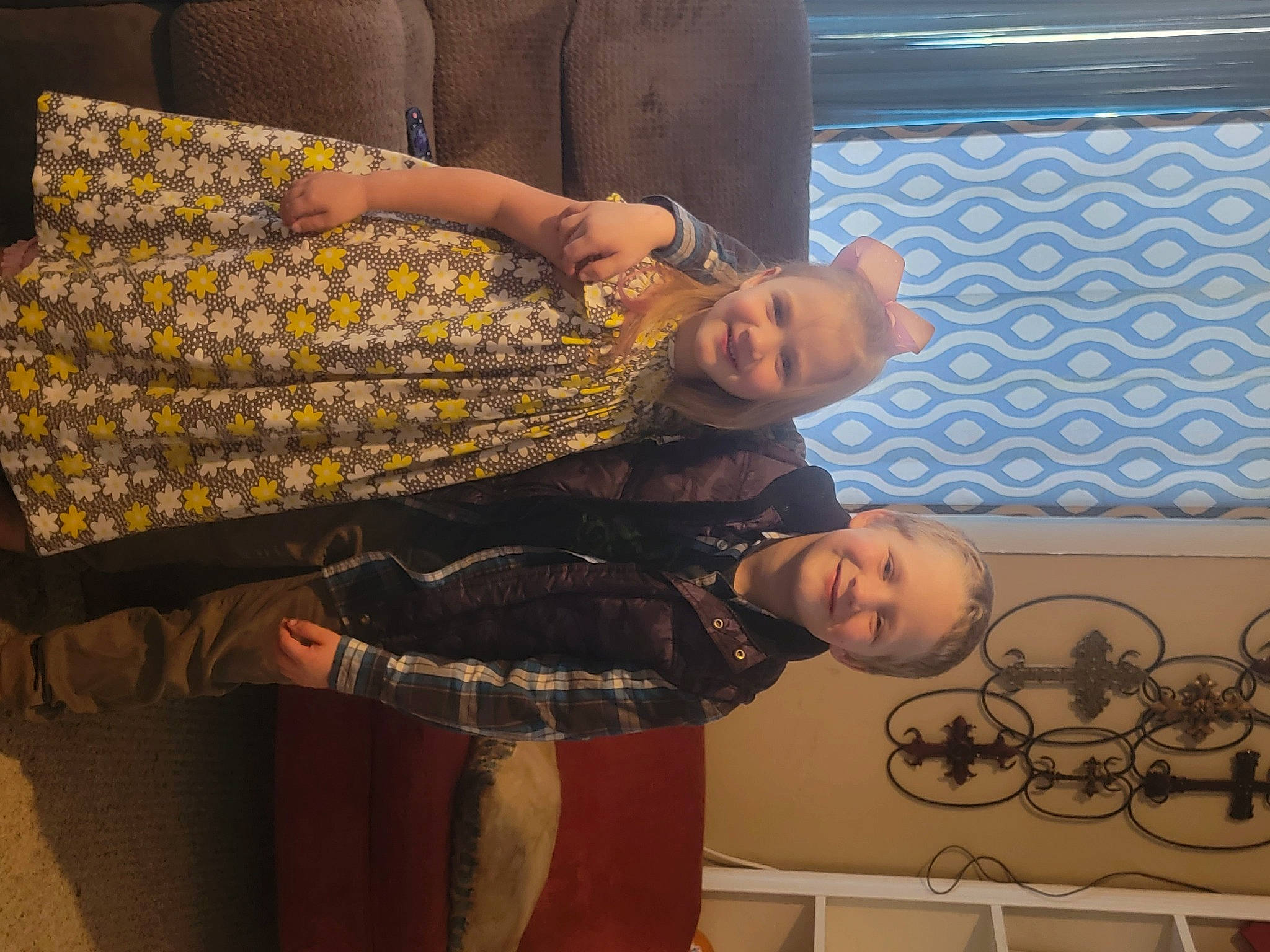 Ellie is registered to the contest to win money with this photo: arm, art, comfort, event, eyewear, fashion_design, flooring, fun, human_body, human_leg, joint, joy, leg, pattern, person, room, shoulder, sitting, tree, trunk