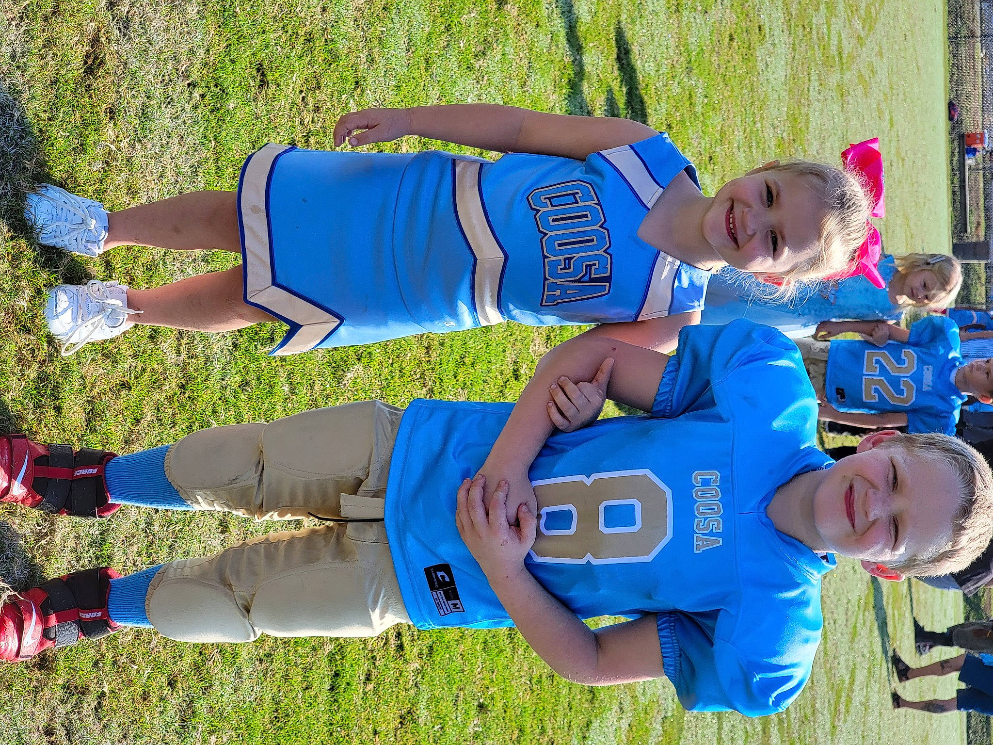 Ellie joined the competition — help win amazing prizes! arm, blue, clothing, competition_event, electric_blue, grass, green, headwear, jersey, joy, leisure, person, player, recreation, shorts, smile, sneakers, sports, sports_uniform, sportswear