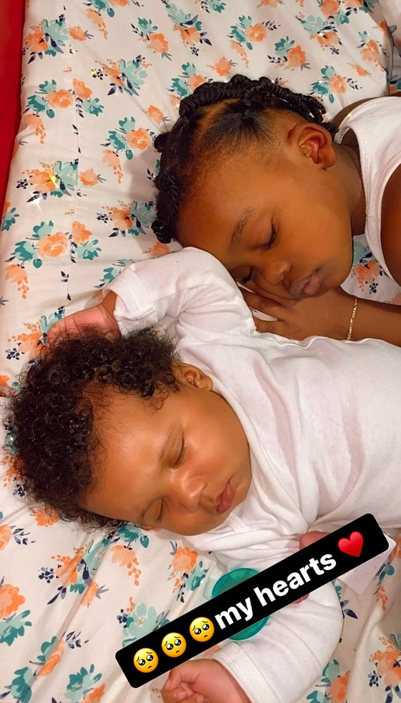 Laylah is registered to the contest to win money with this photo: baby, baby_toddler_clothing, bedding, bedtime, cheek, child, chin, comfort, face, happy, head, linens, mouth, pattern, person, product, room, skin, textile, toddler