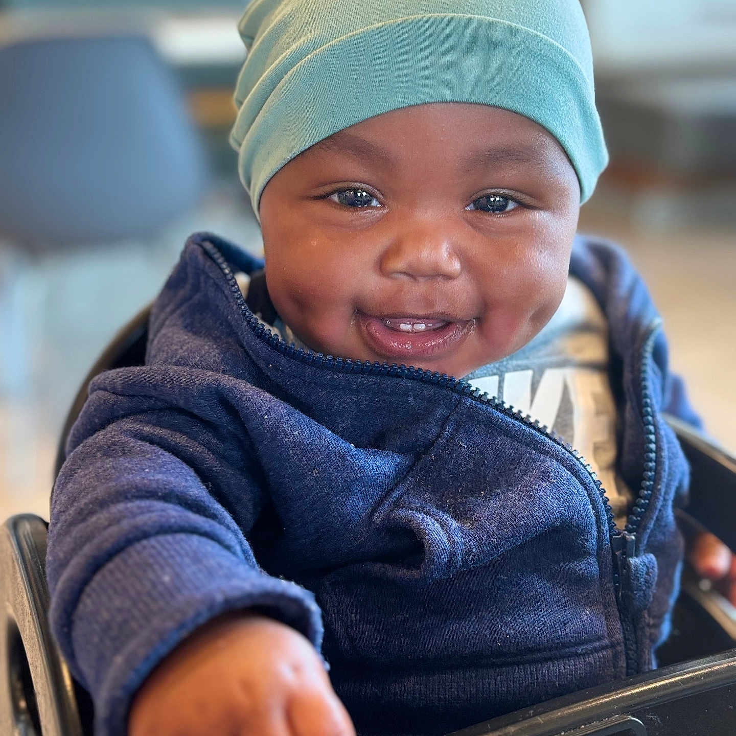 Simon joined the competition — help win amazing prizes! baby, babylaughing, beanie, bodypart, cap, clothing, coat, face, finger, hand, happy, hat, head, jacket, knitwear, pants, person, photography, portrait, smile