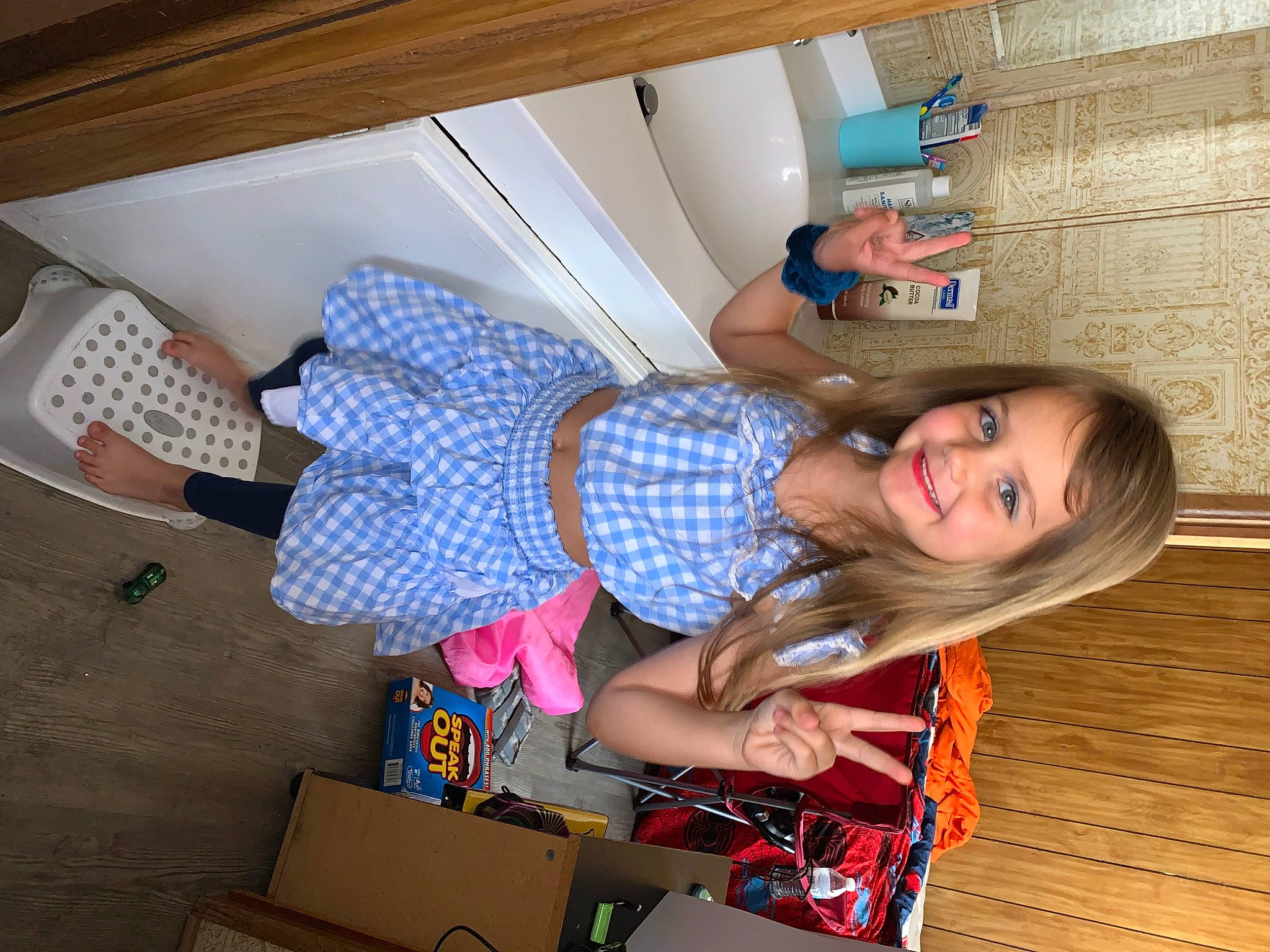 Kaileigh is registered to the contest to win money with this photo: box, cardboard, carton, child, flooring, fun, happy, hardwood, human_leg, joy, knee, packaging_and_labeling, pattern, person, room, shipping_box, smile, thigh, wood