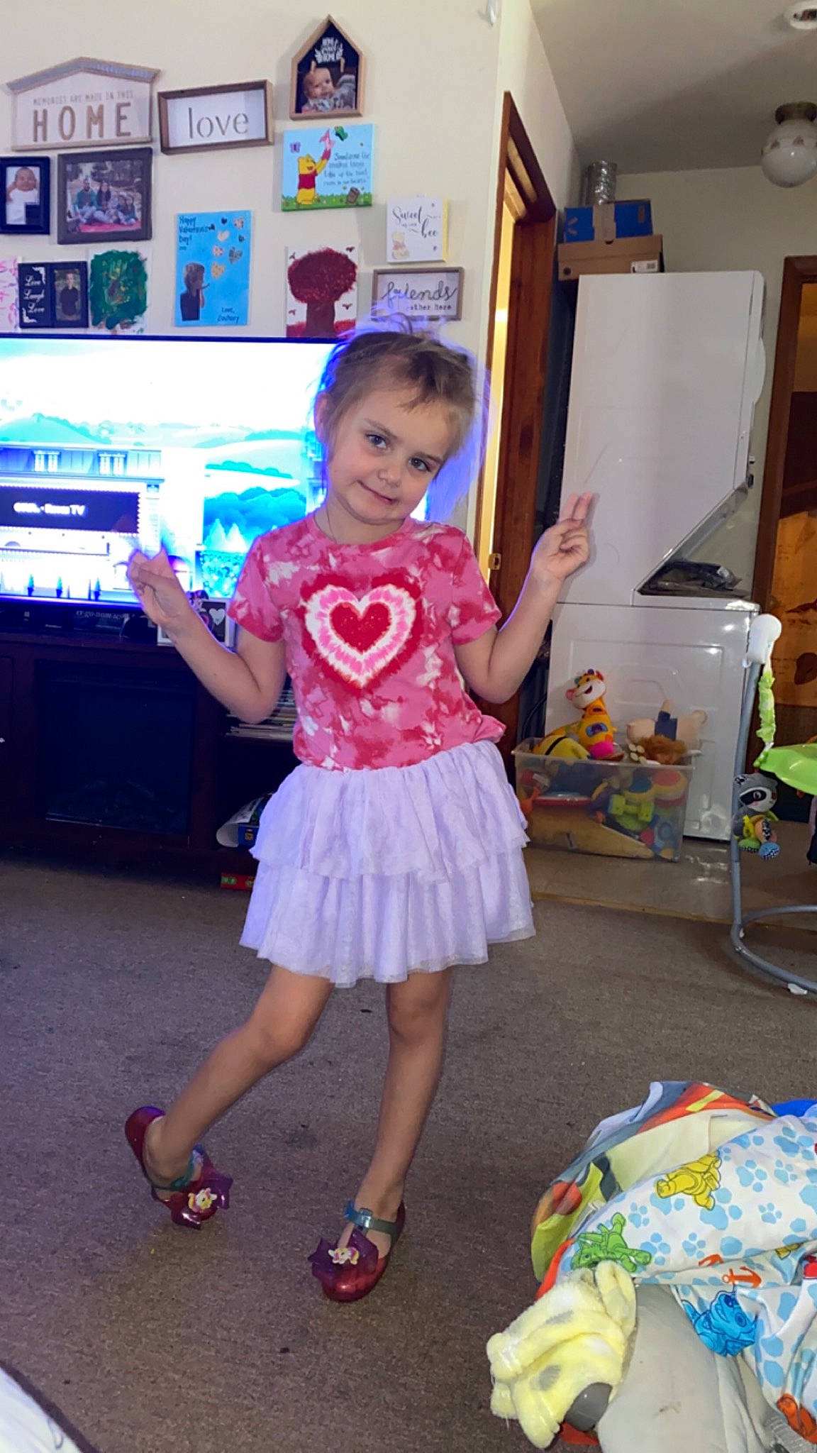 Kaileigh joined the competition — help win amazing prizes! baby_toddler_clothing, child, costume, entertainment, event, fashion_design, flooring, fun, happy, human_leg, joy, leisure, magenta, party, pattern, person, play, room, sandal, television