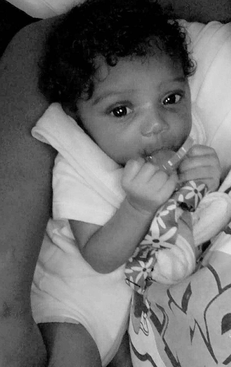 Journee is registered to the contest to win money with this photo: arm, baby, black, black_and_white, cheek, child, eye, face, finger, hand, lip, monochrome, monochrome_photography, nose, person, photograph, skin, smile, snapshot, toddler