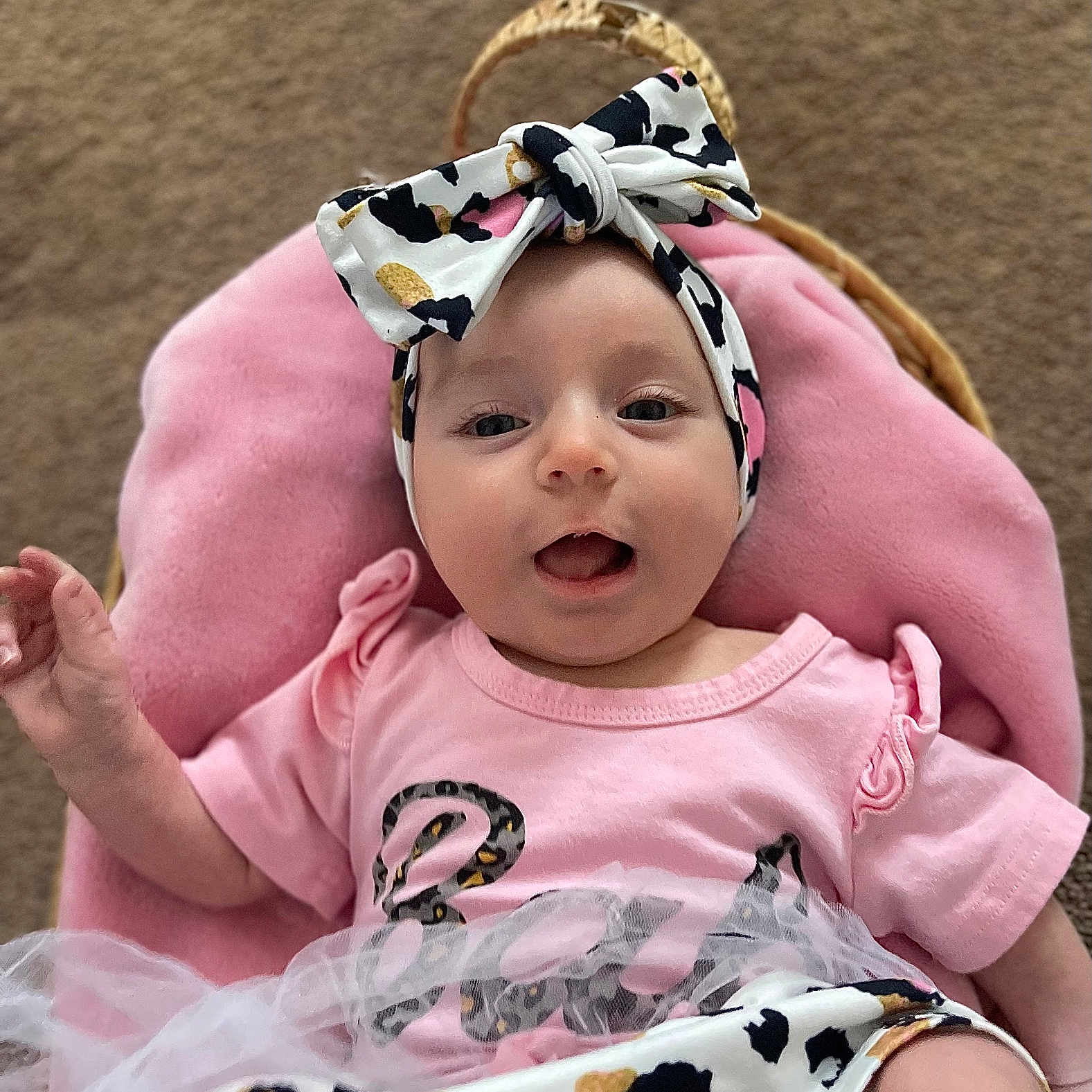 Ivana joined the competition — help win amazing prizes! baby, child, cushion, cute, fabric, face, hand, happy, headband, indoor, infant, leopard_print, person, pink_clothing, portrait, seated, smiling, soft_texture, tutu, young