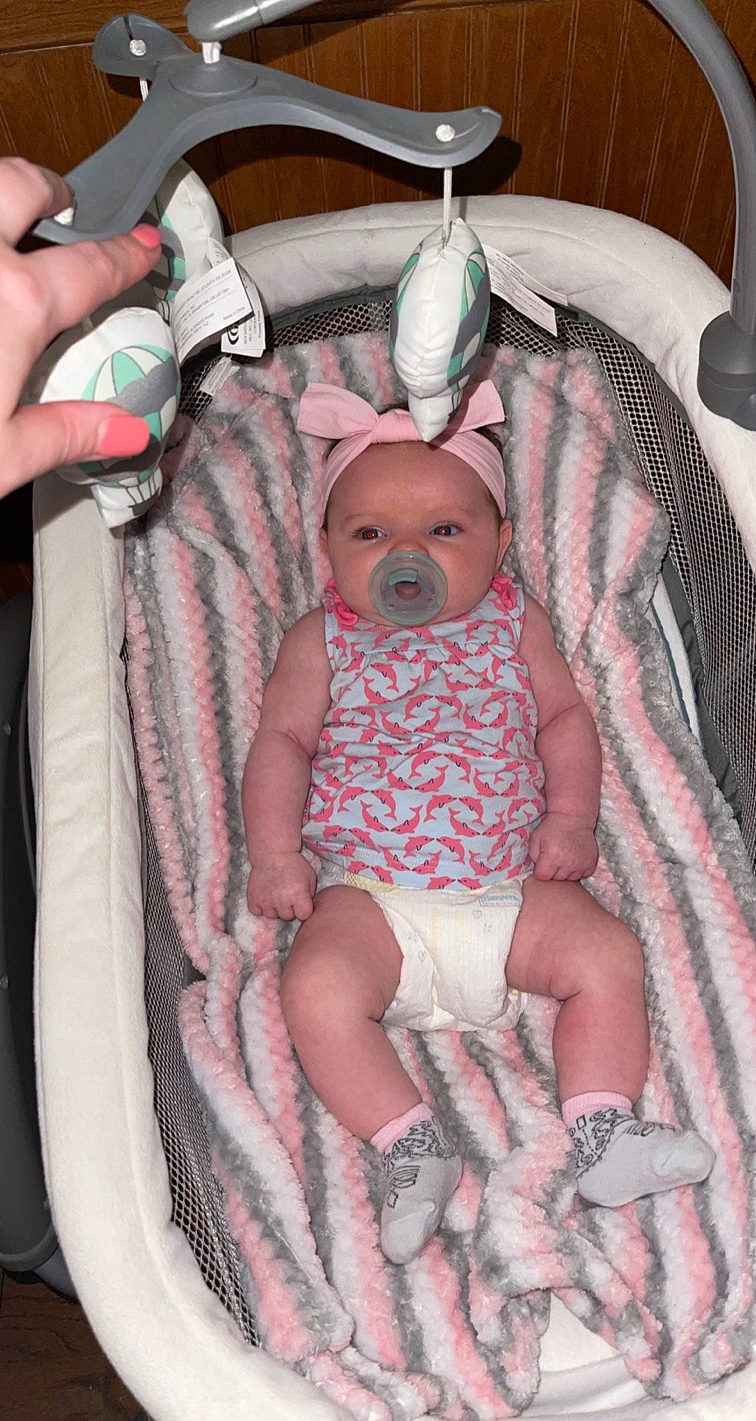 Stormi is registered to the contest to win money with this photo: baby, baby_products, baby_toddler_clothing, chair, child, comfort, event, finger, lap, nail, pattern, person, pink, plate, service, sitting, skin, tableware, thigh, thumb