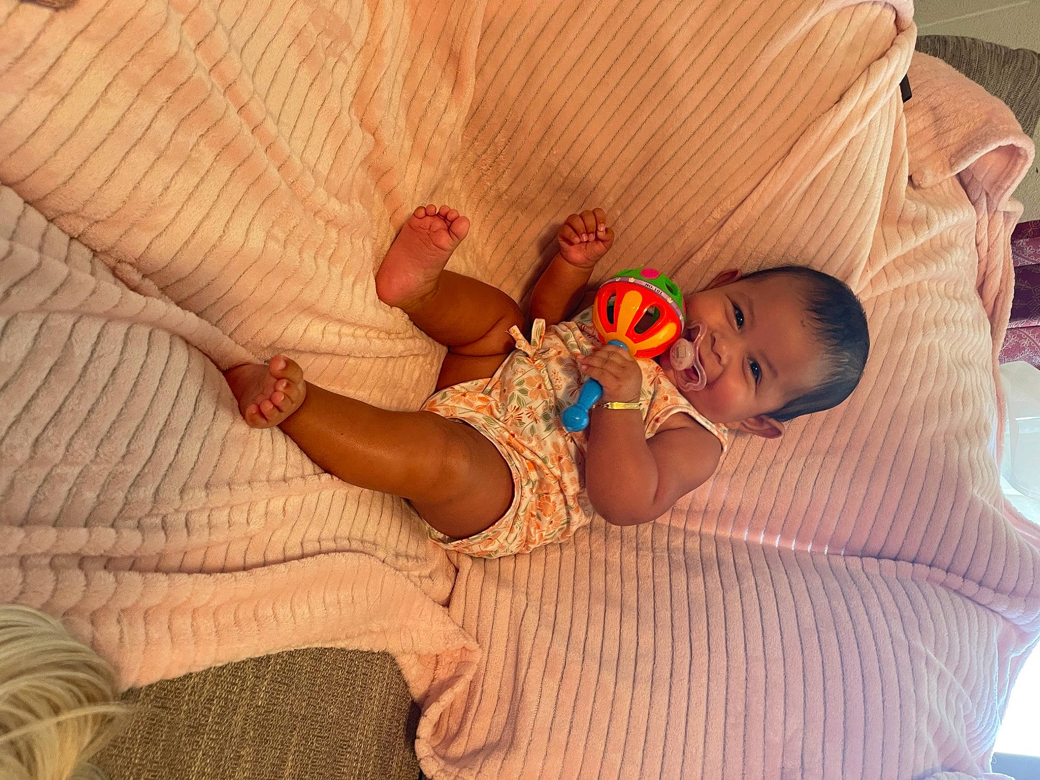 Celeste is registered to the contest to win money with this photo: abdomen, arm, baby, baby_sleeping, baby_toddler_clothing, bedtime, child, comfort, finger, flooring, human_body, joy, linens, mammal, person, sitting, skin, stomach, thigh, toddler
