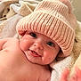 baby, infant, smile, hat, knit_hat, pom_pom, blanket, soft_texture, skin, cheeks, hand, indoors, cute, happy, closeup, portrait, cozy, warm, child, person