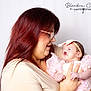 woman, baby, infant, holding, pink_dress, headband, glasses, portrait, studio, smile, love, mother, child, cute, people, face, hands, tender, affection, indoor
