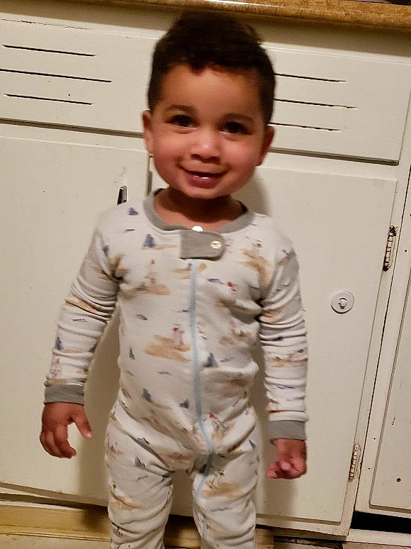 Elijah joined the competition — help win amazing prizes! baby, baby_toddler_clothing, cabinetry, chest_of_drawers, child, drawer, dress_shirt, face, flooring, gesture, hair, happy, head, joy, person, room, sleeve, smile, standing, t_shirt