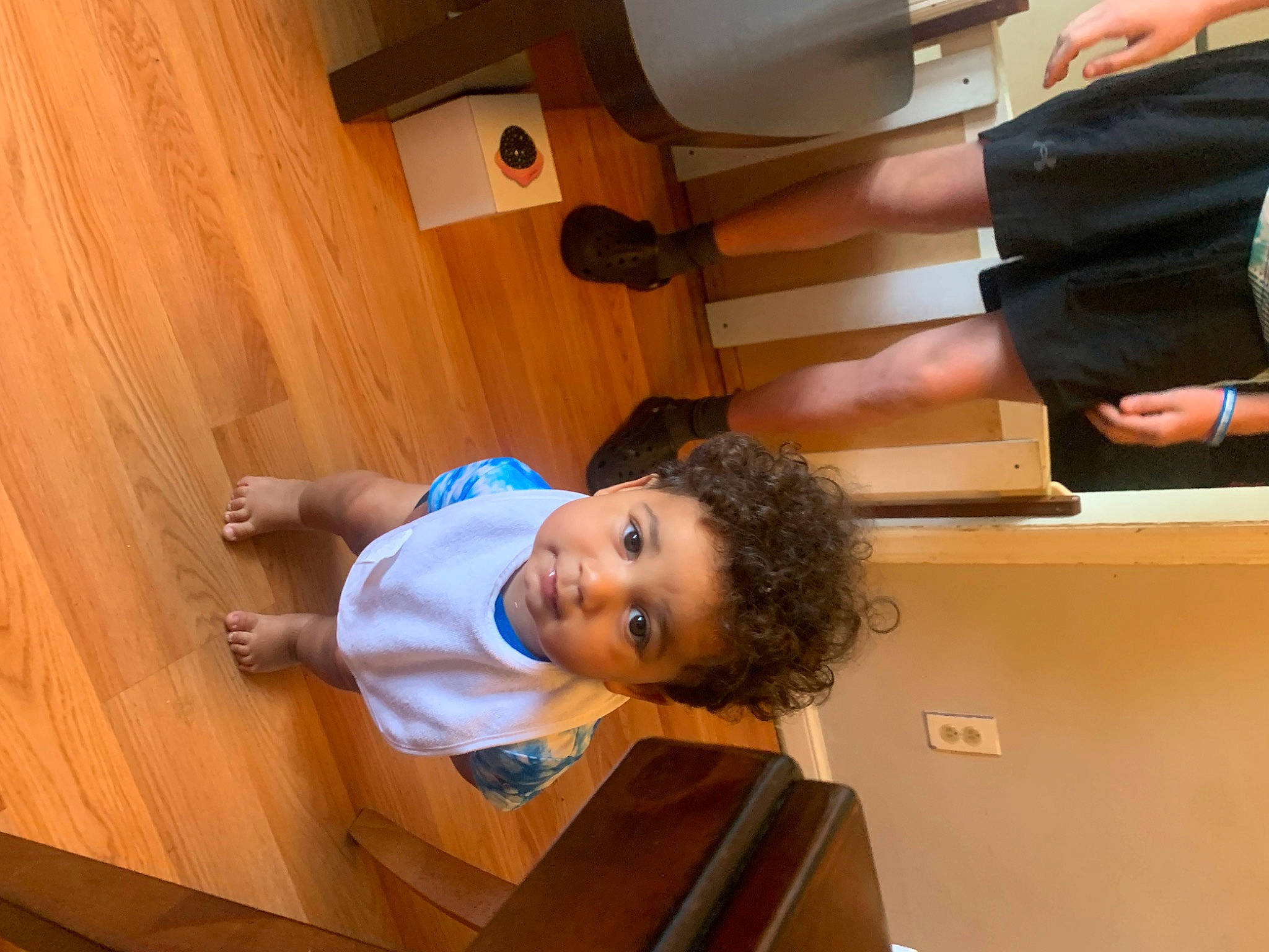 Elijah is registered to the contest to win money with this photo: baby_toddler_clothing, ceiling, child, comfort, elbow, finger, flooring, fun, gesture, happy, hardwood, leisure, person, plywood, room, t_shirt, thumb, toddler, varnish, wood