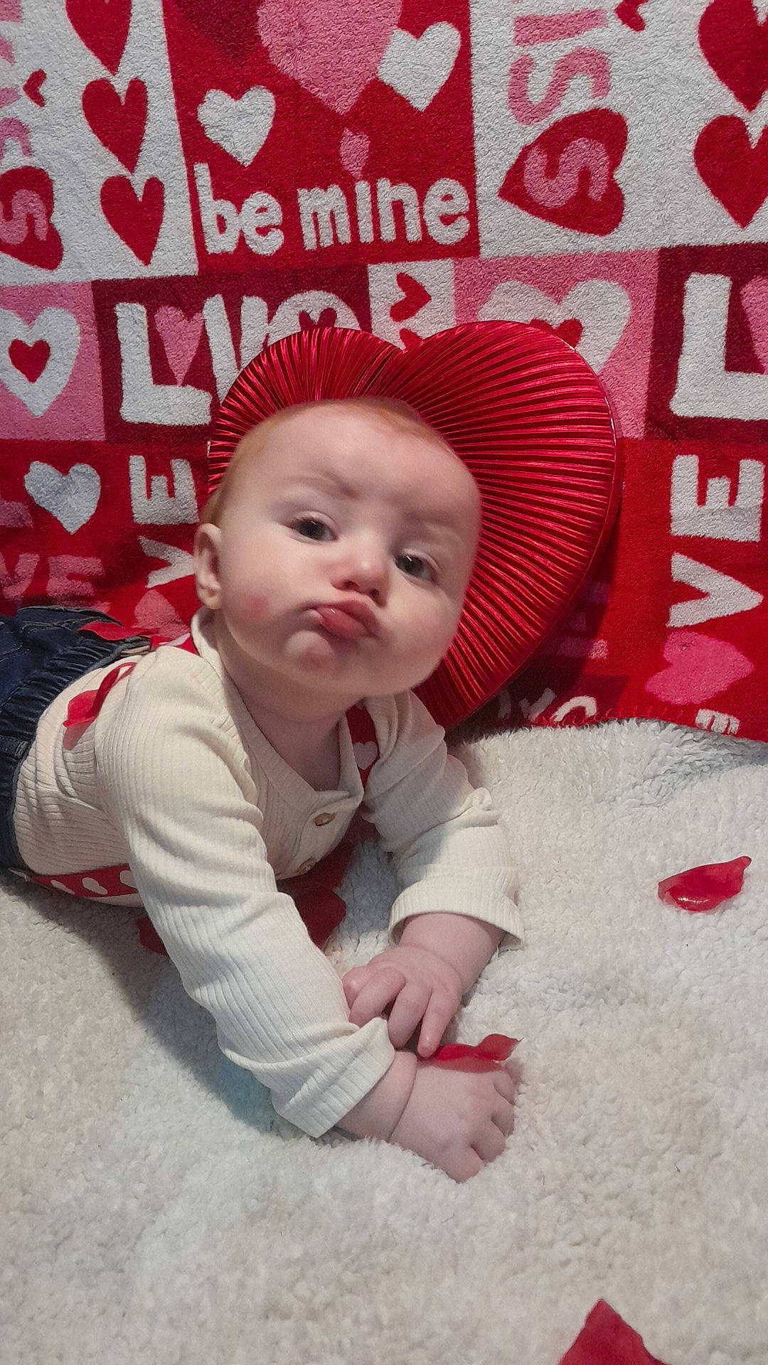 Daxton is registered to the contest to win money with this photo: baby, baby_toddler_clothing, cap, carmine, child, flooring, font, fur, happy, hat, magenta, pattern, person, photo_caption, pink, portrait_photography, poster, sitting, sleeve, sun_hat