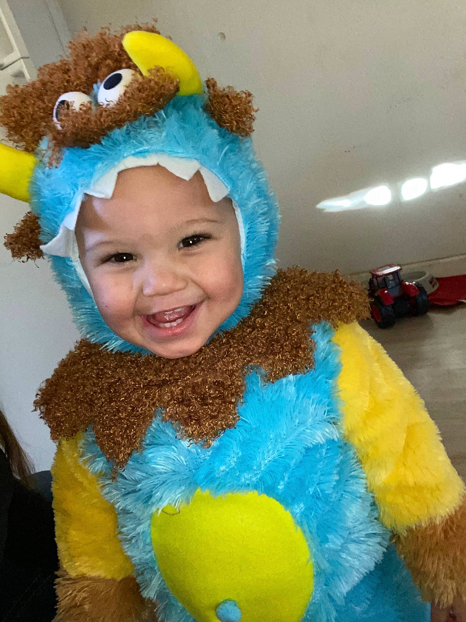 Kobie joined the competition — help win amazing prizes! child, costume, costume_accessory, costume_hat, fun, headgear, headwear, joy, party_supply, person, play, smile, stuffed_toy, toddler, turquoise, yellow