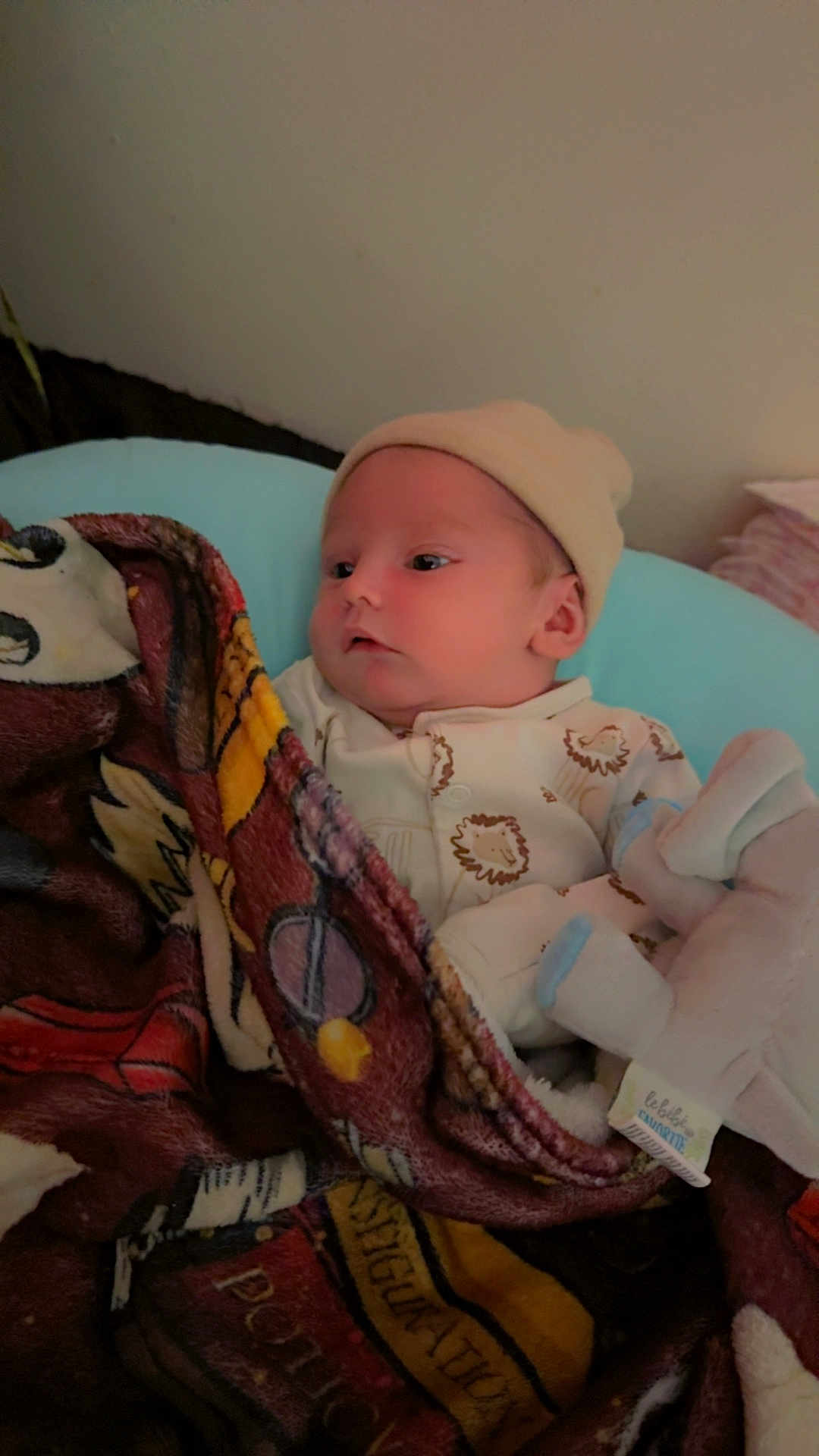 Zaiden joined the competition — help win amazing prizes! baby, blanket, hat, indoor, infant, onesie, soft_toy, wall, bed, sleepwear, child, cute, cozy, person, portrait, resting, young, comfort, fabric, toy