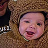 Adessa is registered to the contest to win money with this photo: adult, baby, bear_costume, child, closeup, clothing, costume, cute, expression, face, funny, fuzzy, happy, hood, indoors, joy, person, portrait, smiling, warm