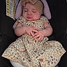 Adessa is registered to the contest to win money with this photo: adorable, baby, car_seat, child, cozy, cute, dress, floral_pattern, hands, headband, indoors, infant, legs, padded, peaceful, rest, seat, sleeping, small_person, white_tights